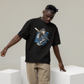 Man wearing a black t-shirt with a graphic design, beige pants, and white sneakers in a minimalistic setting.