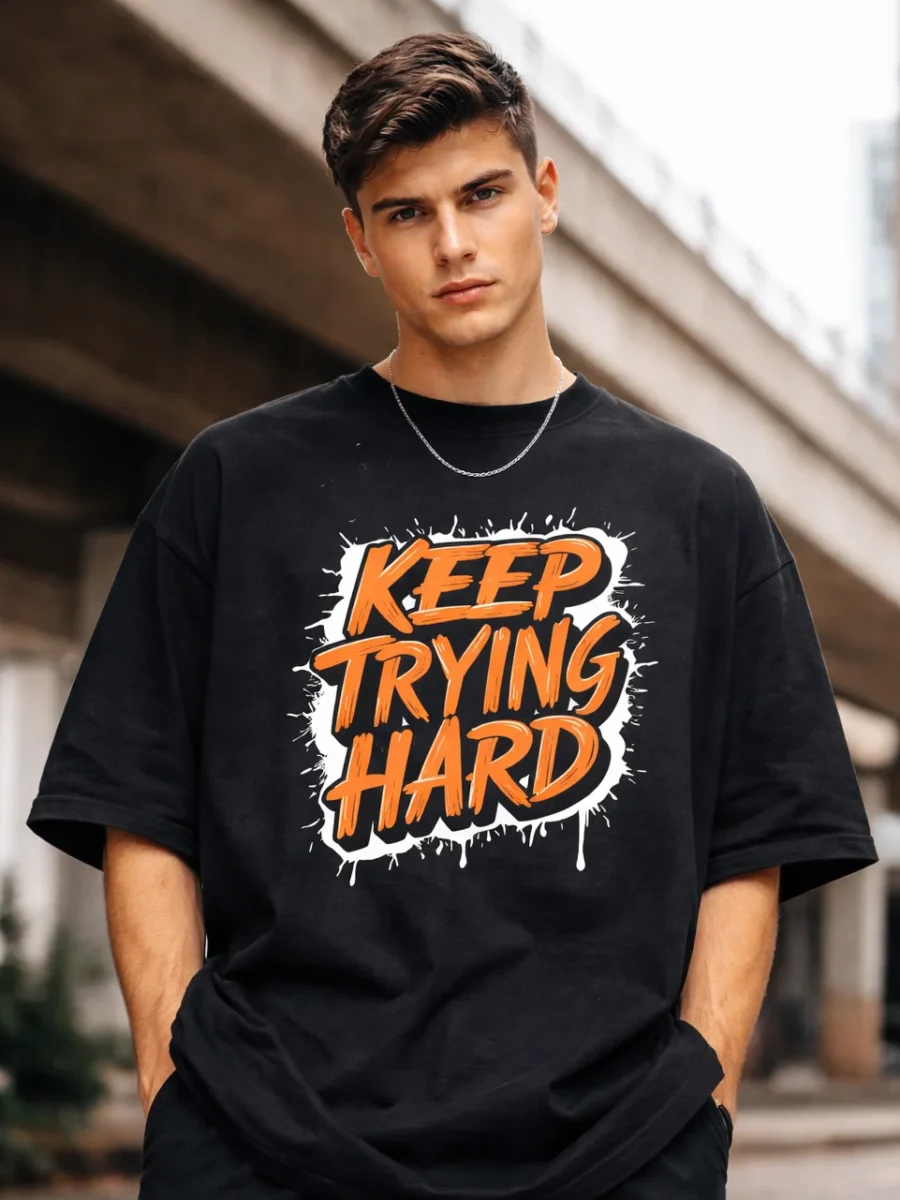 Keep Trying Hard signature print on a black oversized t-shirt